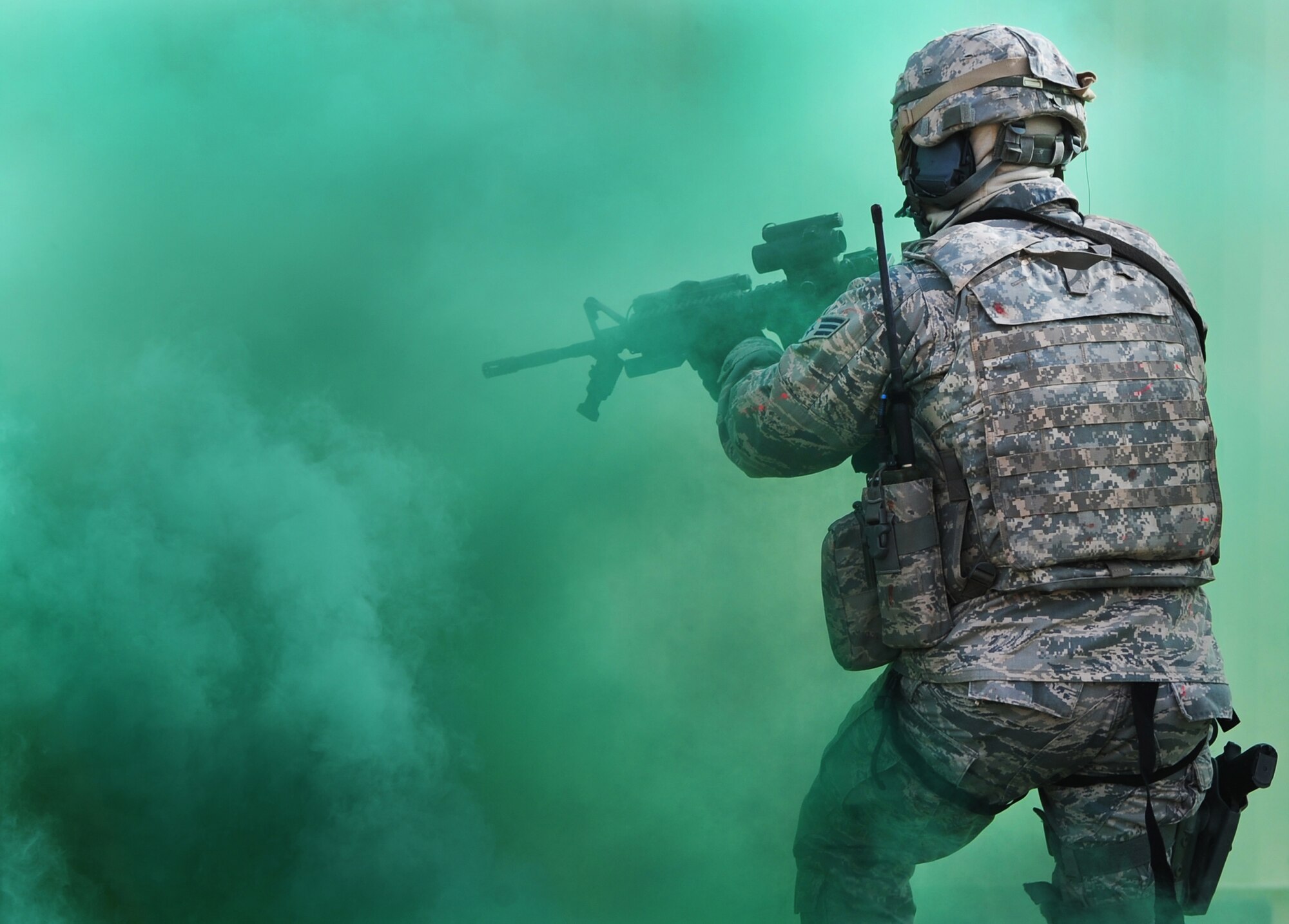 An Air Commando from Cannon Air Force Base, N.M., simulates combat against Opposition Forces at Melrose Air Force Range, N.M., Dec. 18, 2012.  This training gave members of the 27th Special Operations Security Forces Squadron a chance to gain Special Operations Forces Fly Away Security Team certification.  (U.S. Air Force photo/Airman 1st Class Ericka Engblom)