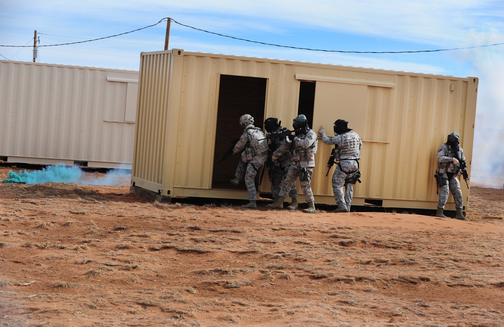 Air Commandos from Cannon Air Force Base, N.M., clear a building during combat training at Melrose Air Force Range, N.M., Dec. 18, 2012.  This training gave members of the 27th Special Operations Security Forces Squadron a chance to gain Special Operations Forces Fly Away Security Team certification.  (U.S. Air Force photo/Airman 1st Class Ericka Engblom)