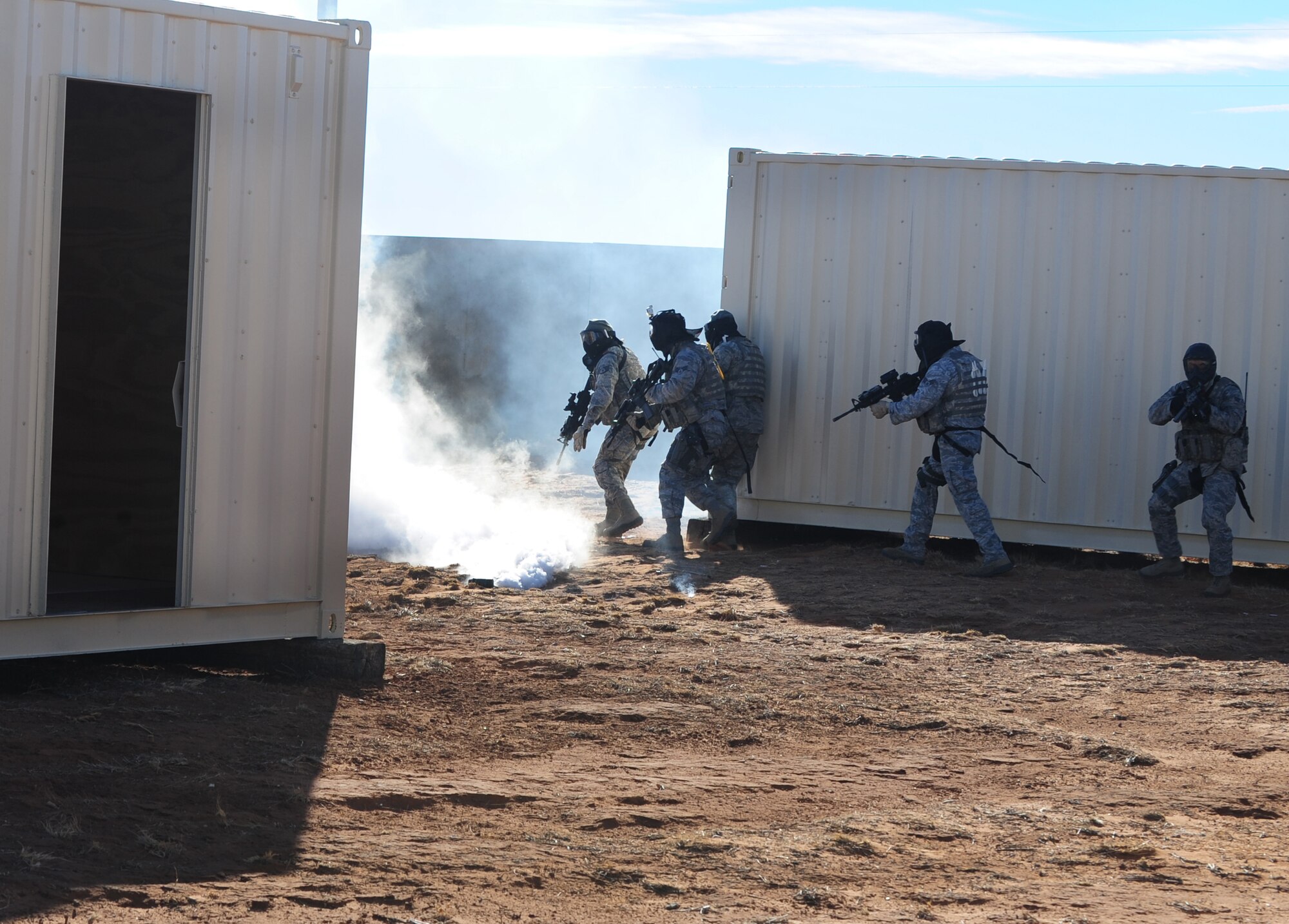 Members of the 27th Special Operations Security Forces Squadron simulate combat against Opposition Forces at Melrose Air Force Range, N.M., Dec. 18, 2012.  This training gave the Air Commandos a chance to gain Special Operations Forces Fly Away Security Team certification.  (U.S. Air Force photo/Airman 1st Class Ericka Engblom)