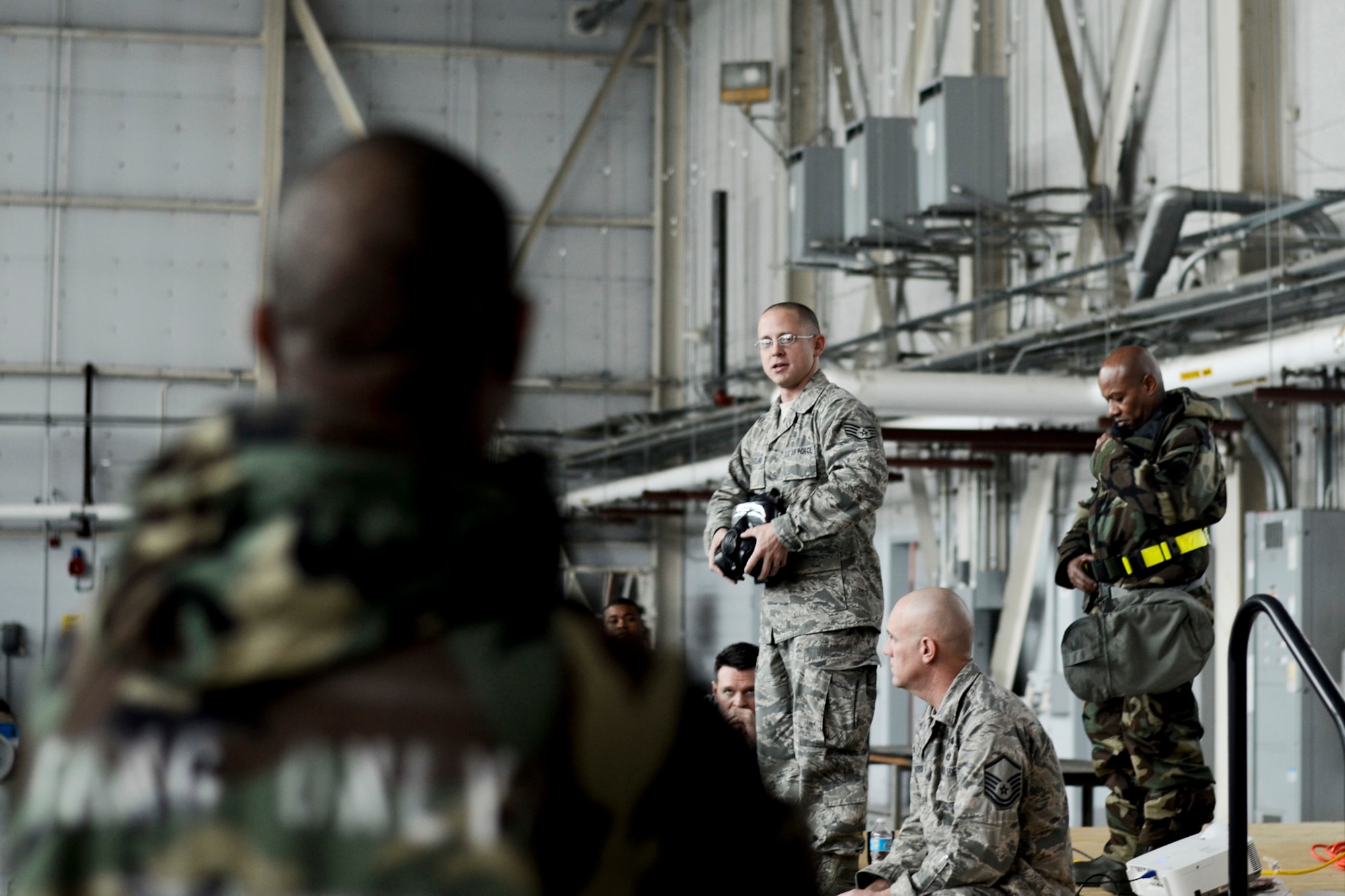 169th Fighter Wing, Airmen participate in the Ability To Survive and Operate (ATSO) training in the base hanger, December 9, 2012, McEntire Joint National Guard Base, S.C. This training is being conducted in large venues throughout the December UTA to reduce time spent on computer based training and get a more hands on training to be prepared for the unit's upcoming Operational Readiness Inspection (ORI).   (National Guard photo by Staff Sgt Jorge Intriago/Released)