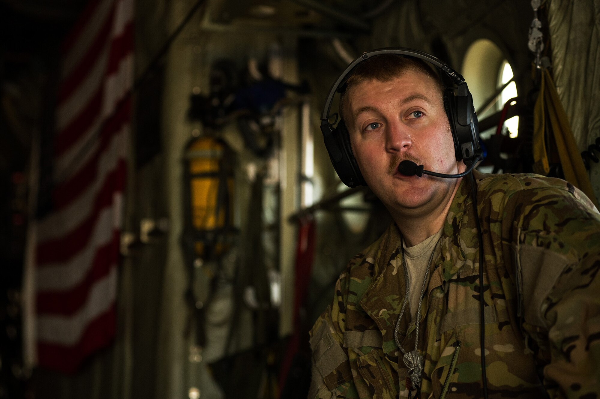 U.S. Air Force Tech. Sgt. Dave Hoffer, 772nd Expeditionary Airlift Squadron loadmaster, communicates with the pilot during a pre-flight check on a U.S. Air Force C-130J Super Hercules Dec. 2, 2012, at Kandahar Airfield, Afghanistan. The 772nd EAS provides tactical airlift, airdrop and aeromedical evacuation, creating an air bridge for personnel, equipment and supplies. Hoffer's hometown is Rockton, Pa. (U.S. Air Force photo/Staff Sgt. Jonathan Snyder)