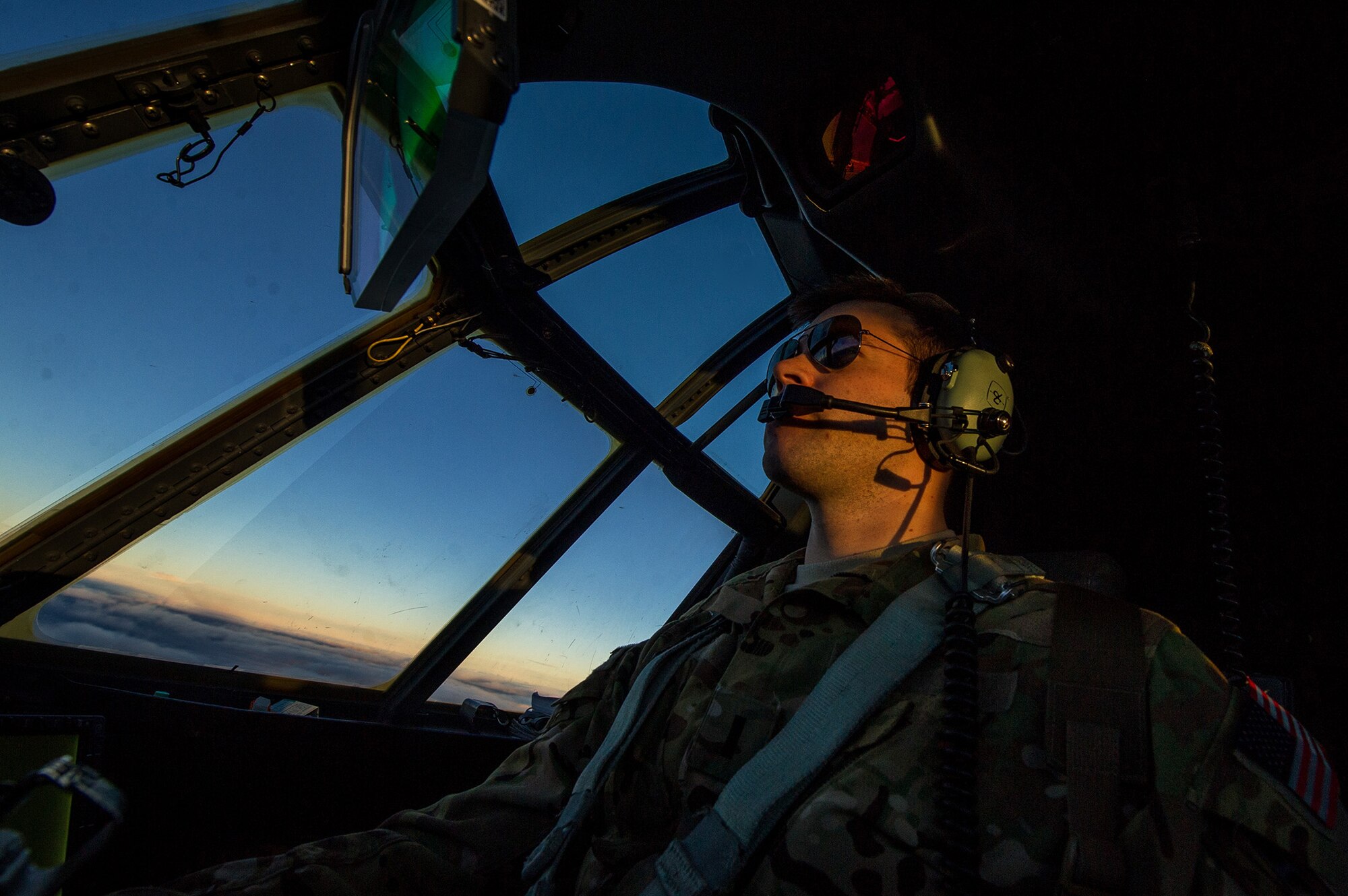 U.S. Air Force 1st Lt. John Fugate, 772nd Expeditionary Airlift Squadron pilot, flies a U.S. Air Force C-130J Super Hercules Dec. 7, 2012, at a forward operating base, Afghanistan. The 772nd EAS provides tactical airlift, airdrop and aeromedical evacuation, creating an air bridge for personnel, equipment and supplies. Fugate's hometown is DuBois, Pa. (U.S. Air Force photo/Staff Sgt. Jonathan Snyder)