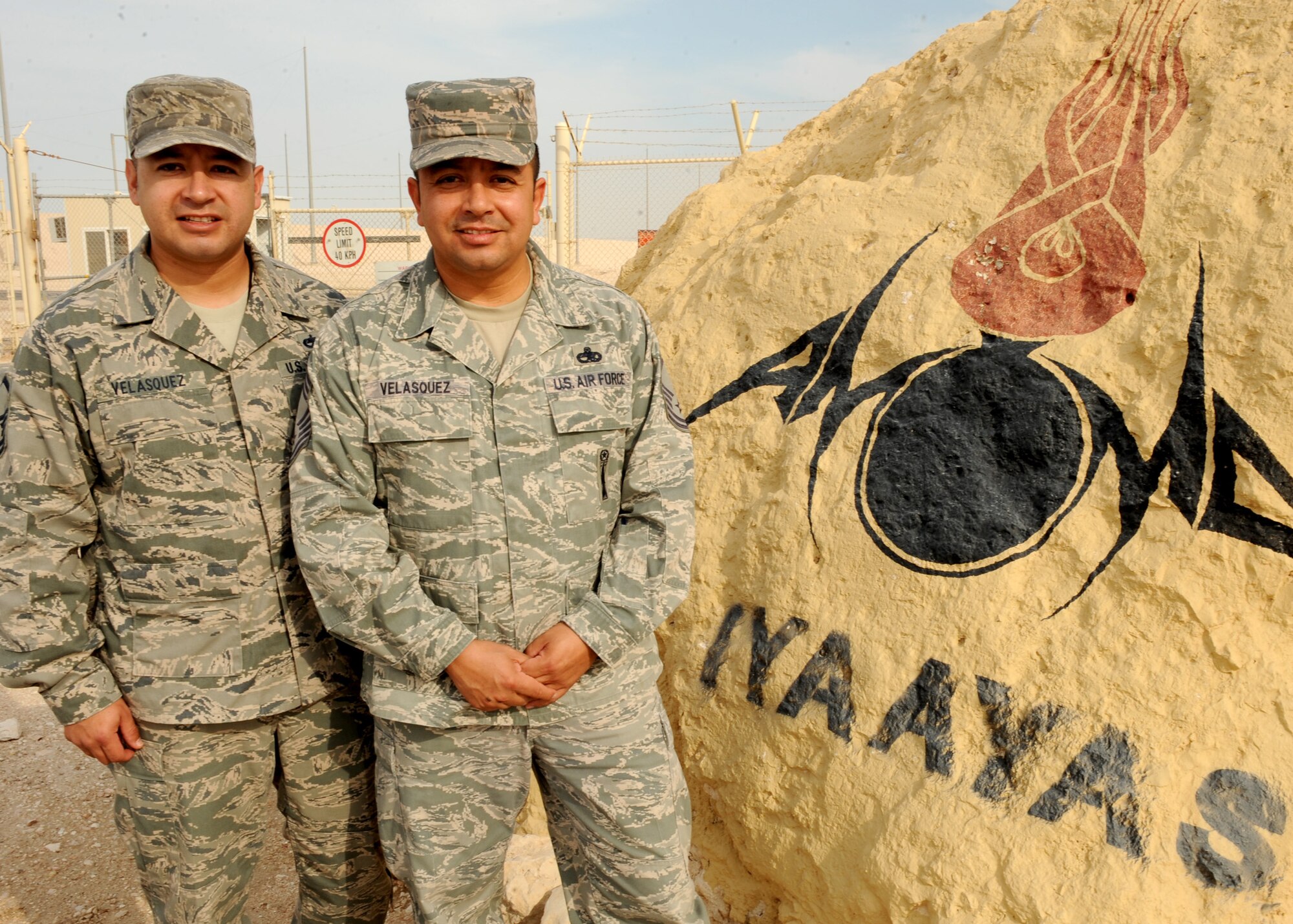 SOUTHWEST ASIA – Master Sgt. Daniel Velasquez (left), 379th Expeditionary Maintenance Operations Squadron, and Chief Master Sgt. Richard Velasquez, 379th Expeditionary Maintenance Squadron, are brothers deployed in the same location at the 379th Air Expeditionary Wing. The two brothers along with their younger sibling Army Sgt. Andrew Velasquez, who was recently stationed in Afghanistan, were deployed at the same time in 2012. The master sergeant is deployed from Dyess Air Force Base Texas, the chief’s is deployed from Barksdale, AFB, La., and the Army sergeant is a reservist out of Austin, Texas. (U.S. Air Force photo/Senior Airman Joel Mease)