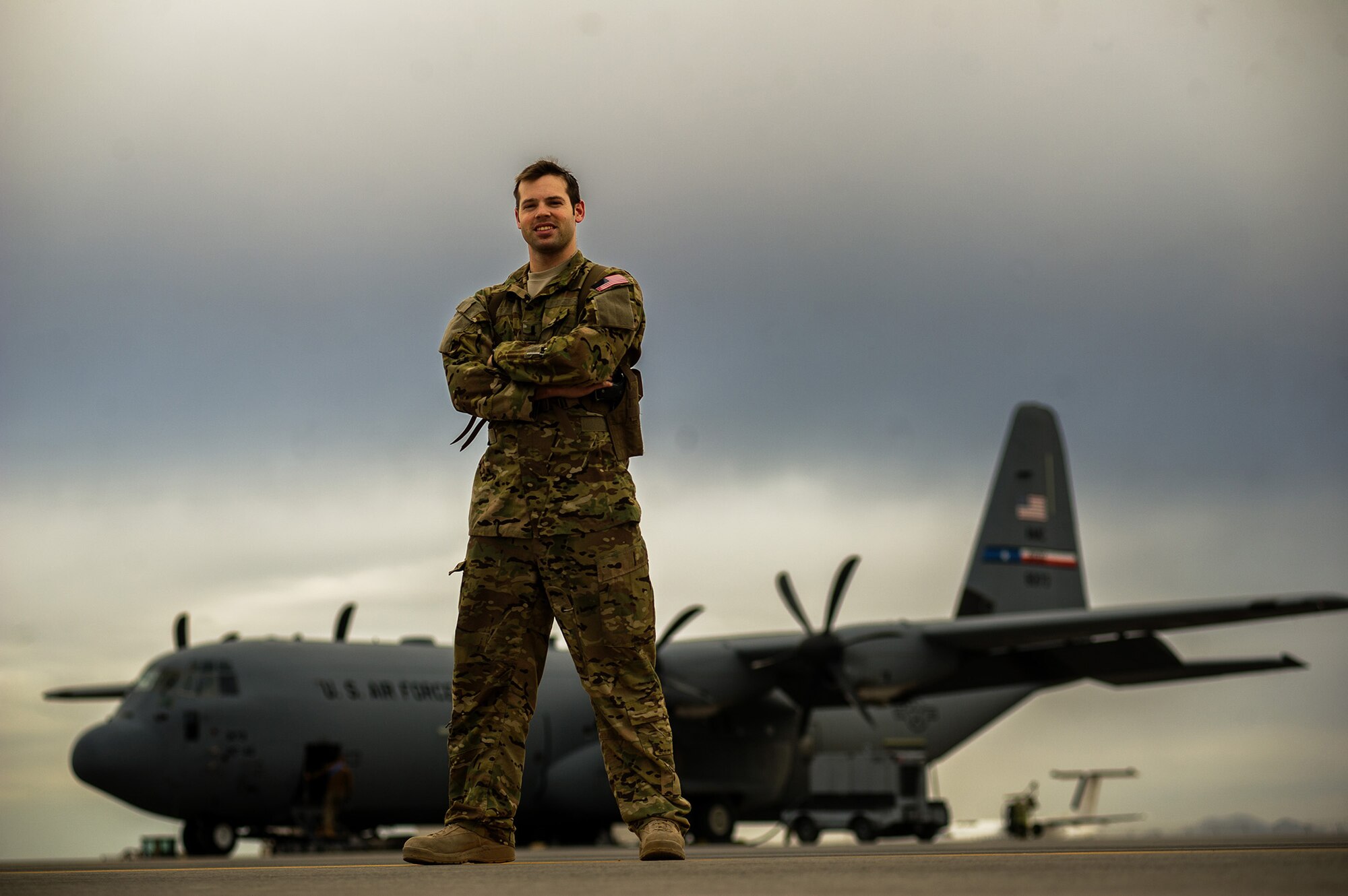U.S. Air Force 1st Lt. John Fugate, 772nd Expeditionary Airlift Squadron pilot, stands in front of a U.S. Air Force C-130J Super Hercules after completing a combat mission Dec. 7, 2012, at Kandahar Airfield, Afghanistan. The 772nd EAS provides tactical airlift, airdrop and aeromedical evacuation, creating an air bridge for personnel, equipment and supplies. Fugate's hometown is DuBois, Pa. (U.S. Air Force photo/Staff Sgt. Jonathan Snyder)