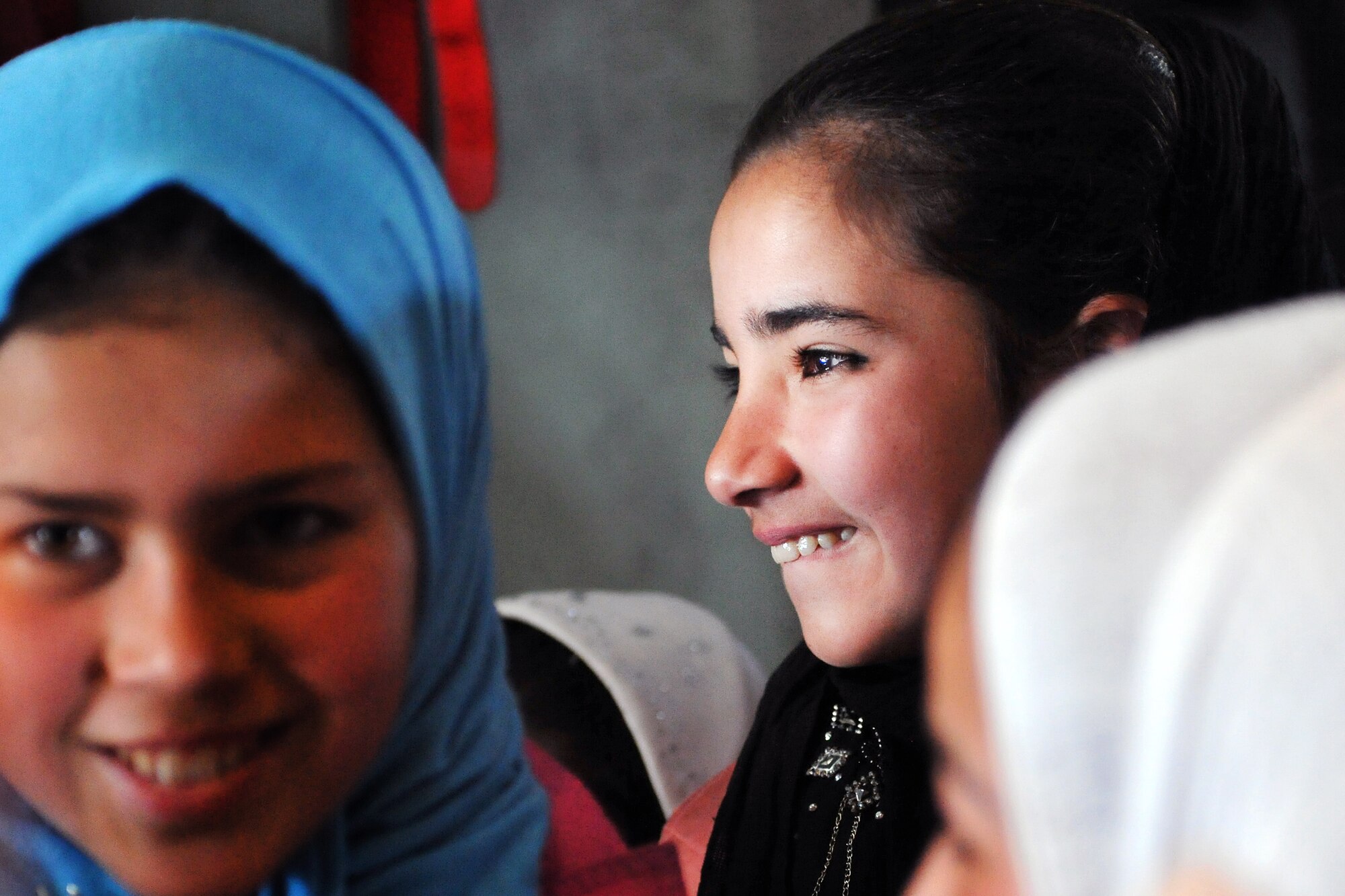 Local Afghan girls enrolled in the “Cat in the Hat” education program take a tour of a C-130 Hercules at Bagram Airfield, Afghanistan, Dec. 20, 2012. The program is a volunteer-run community outreach effort designed to provide local Afghan children a safe, nurturing learning environment in which they are inspired to bring positive change to Afghanistan. (U.S. Air Force photo/Senior Airman Chris Willis)
