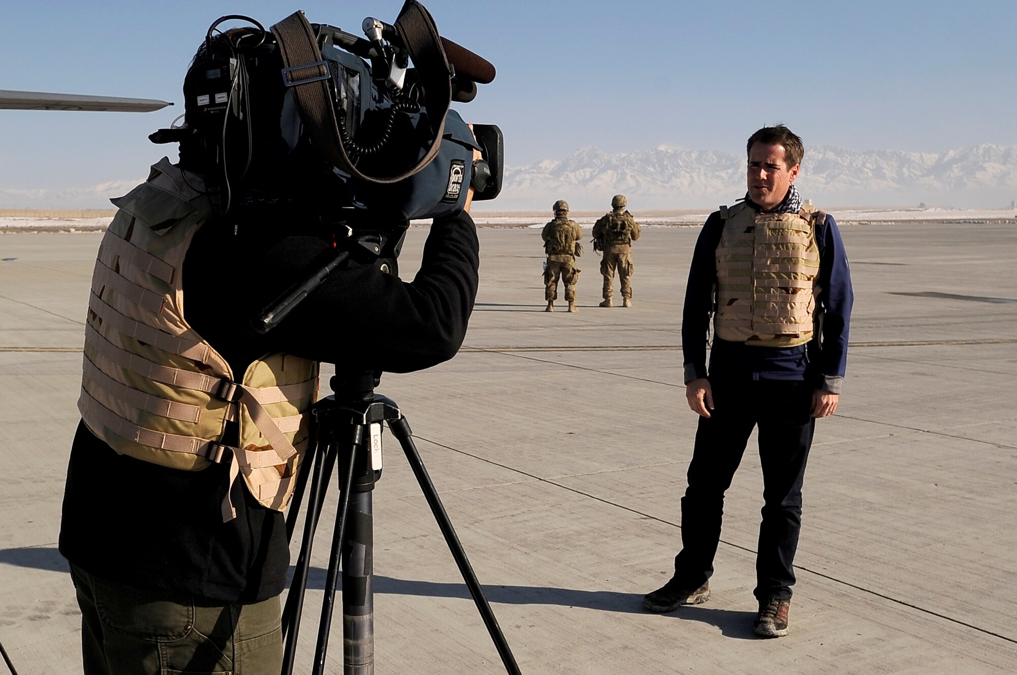 News anchor Jeremy Hubbard and videographer Noah Skinner from Denver’s Fox 31, record a news segment at Forward Operating Base Shank in Logar Province, Afghanistan on Dec. 18, 2012. Hubbard is doing a special newscast on members of the 455th Expeditionary Aeromedical Evacuation Team deployed from the Peterson Air Force Base, Colo. (U.S. Air Force Photo/Master Sgt. Jun Kim)