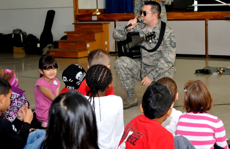 U.S. Air Force Tech. Sgt. Justin Allen, U.S. Air Force Band of the Pacific-Asia Jazz Combo vocalist, sings to children at Sollars Elementary School Dec. 10, 2012, Misawa Air Base, Japan.  This was the first stop on a three-day caroling tour at Misawa Air Base and Misawa City. (U.S. Air Force photo by Tech. Sgt. Phillip Butterfield)