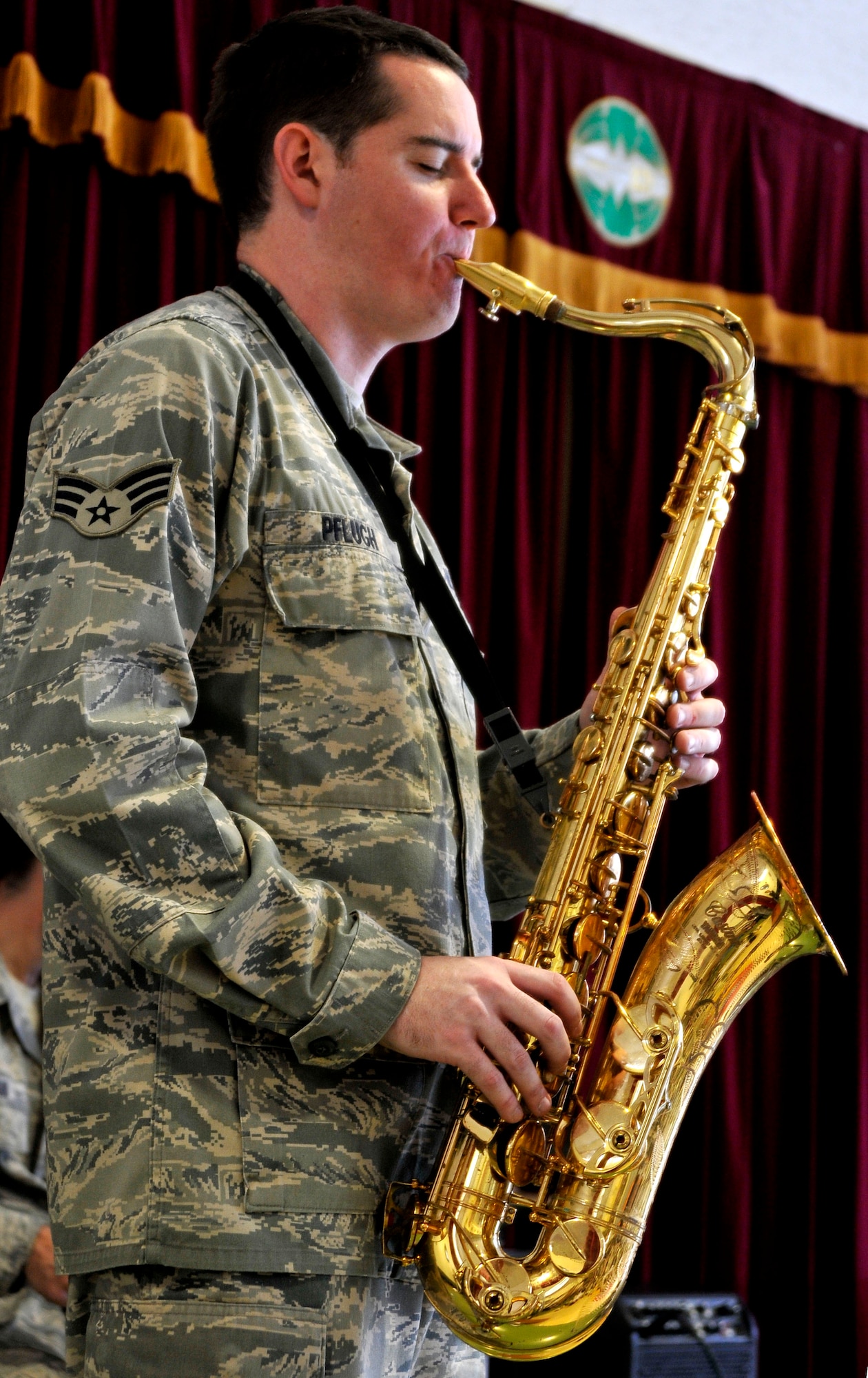 U.S. Air Force Senior Airman Greg Pflugh, U.S. Air Force Band of the Pacific-Asia Jazz Combo operations manager, plays his saxophone to children at the Misawa Municipal First Preschool Dec. 10, 2012, Misawa City, Japan.  The band performed for more than 200 children during this visit. (U.S. Air Force photo by Tech. Sgt. Phillip Butterfield)