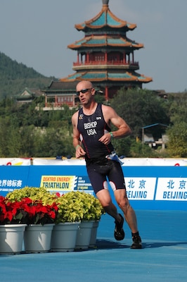 David Bishop runs in the distance portion of the Olympic Distance Triathlon Sept. 11, 2011 during the International Triathlon Union World Championship Grand Final in Beijing.  Bishop, a member of Team USA, is a project planner for the U.S. Army Corps of Engineers Nashville District. He competed in the 50-54 age group during the competition. (Courtesy photo)