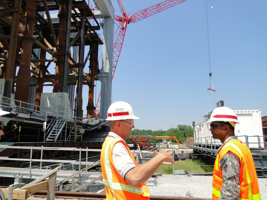 New chief of the U.S. Army Corps of Engineers Lt. Gen. Thomas Bostick visited the Olmsted Locks and Dam construction project on the lower Ohio River May 24, 2012. He is shown here in the shadow of the super gantry crane with Rick Schipp, assistant chief of construction, Louisville District. This was Bostick’s first visit as chief to a Corps of Engineers field site.

(U.S. Army Corps of Engineers photo by Mark Wise)