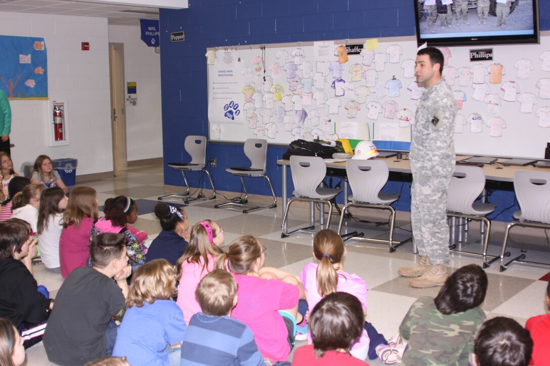 MAJ Tom Piazze talks to 5th graders at Dallastown Area Intermediate School about deploying to Afghanistan and the importance of science, engineering, technology and math. The students wrote letters to deployed Baltimore District employees during the holidays. 