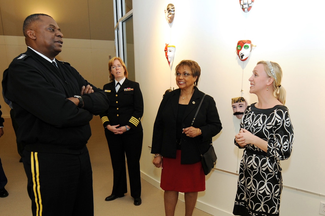 Vice Chief of Staff of the Army Gen. Lloyd J. Austin III, left, and his wife Charlene, second from left, speak with Melissa Walker, art therapist and Healing Arts Program coordinator, right, at the National Intrepid Center of Excellence at Walter Reed National Military Medical Center in Bethesda, Md., Dec. 19, 2012. The center helps military members with post-traumatic stress disorder and traumatic brain injuries. DOD photo by EJ Hersom