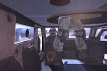 An image from a digital-convoy simulator depicts the scene inside a tactical vehicle for Marines with 2nd Supply Battalion, 2nd Marine Logistics Group as they conduct a training exercise aboard Camp Johnson, N.C., Dec. 19, 2012. The simulator allowed the Marines to integrate real-time situations into their combat operations center training and added an additional twist to each scenario given to the unit’s leadership. 