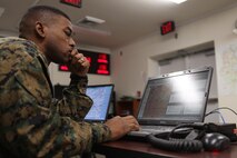 Warrant Officer Terence D. Bennett, a participant in 2nd Supply Battalion, 2nd Marine Logistics Group’s training exercise at Marine Air-Ground Task Force Integrated Systems Training Center aboard Camp Johnson, N.C., monitors his unit’s area of operations during a simulation Dec. 19, 2012. Bennett monitored activities in his area of responsibility and helped coordinate the combat operations center’s efforts to conduct missions during a variety of scenarios.