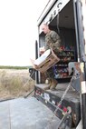 Staff Sgt. Donald W. Tubbs, a morale, welfare, recreation specialist with Combat Logistics Regiment 27, 2nd Marine Logistics Group, unloads supplies for a Warfighter Express Services Team aboard Camp Lejeune, N.C., Dec. 18, 2012. The operation provided members of the 24th Marine Expeditionary Unit with a welcome taste of home as they returned from nearly nine months of deployment.