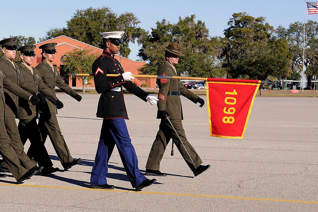 Pfc. Joel Riley, honor graduate of platoon 1098, marches across the parade deck during the pass and review portion of graduation aboard Parris Island, S.C., Dec 21, 2012. Upon graduation, Riley will be able to go back to his hometown, Gretna, La., to enjoy some much deserved leave.