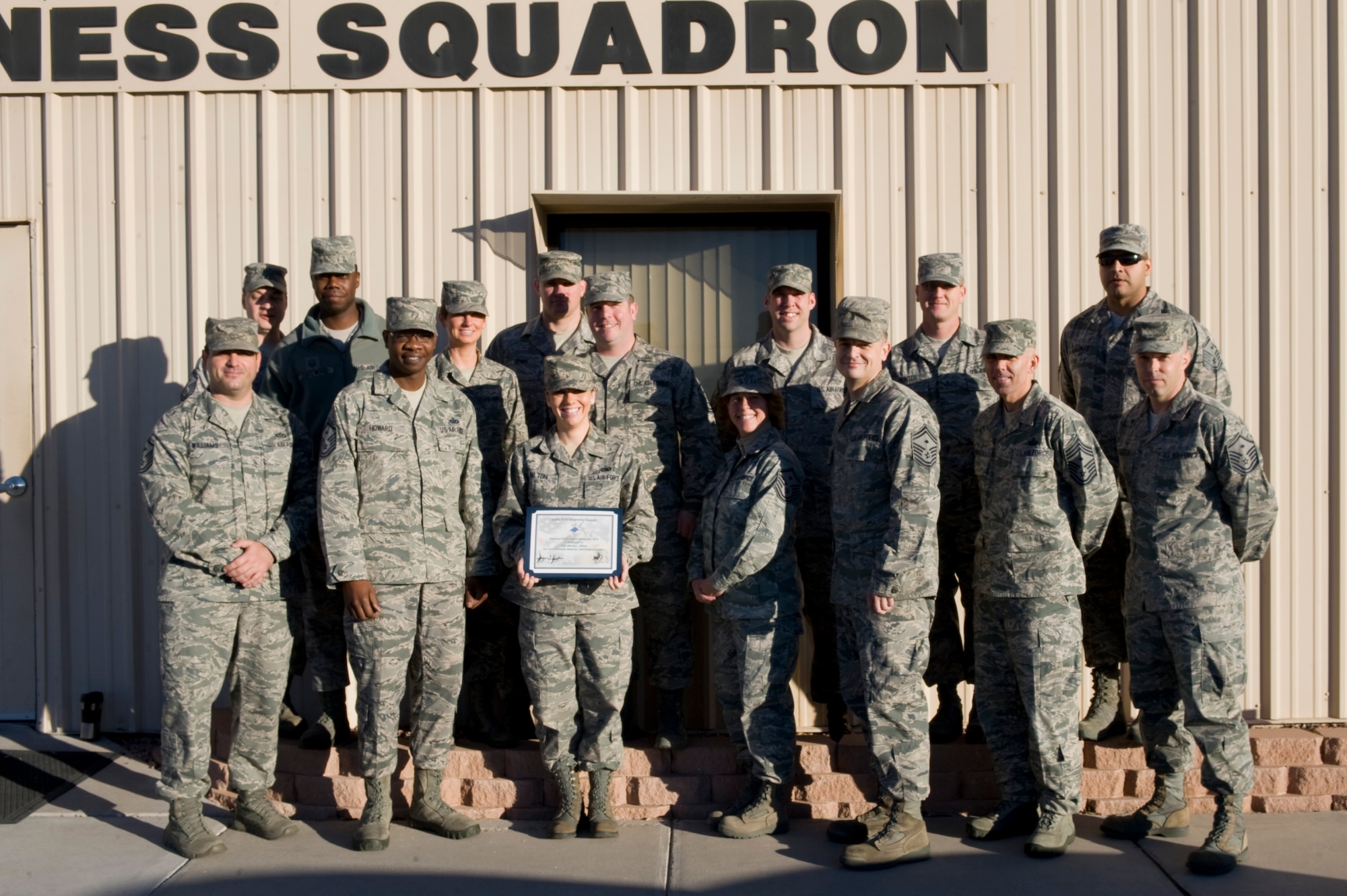 Members of the Nellis First Sergeants' Association present the Diamond Sharp Award to Staff Sgt. Mandy Hilton, 99th Logistics Readiness Squadron knowledge operations NCO in charge Dec. 21, 2012, at Nellis Air Force Base, Nev. Hilton established a new automated job tracking system, resulting in a 99 percent on time rate. Additionally she served as the 99th LRS Aviation Nation representative, raising more than $2k for squadron events. (U.S. Air Force photo by Airman 1st Class Christopher Tam)
