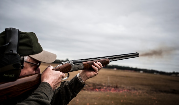 John Caputo, Joint Base Charleston Skeet and Trap Range volunteer, shoots at a clay bird during a round of skeet Dec. 15, 2012, at JB Charleston – Air Base. Caputo, along with several other local veterans, volunteer their time to make sure the range is kept esthetically nice and to help attendees have a safe enjoyable time while shooting skeet and trap. (U.S. Air Force photo/ Senior Airman Dennis Sloan)