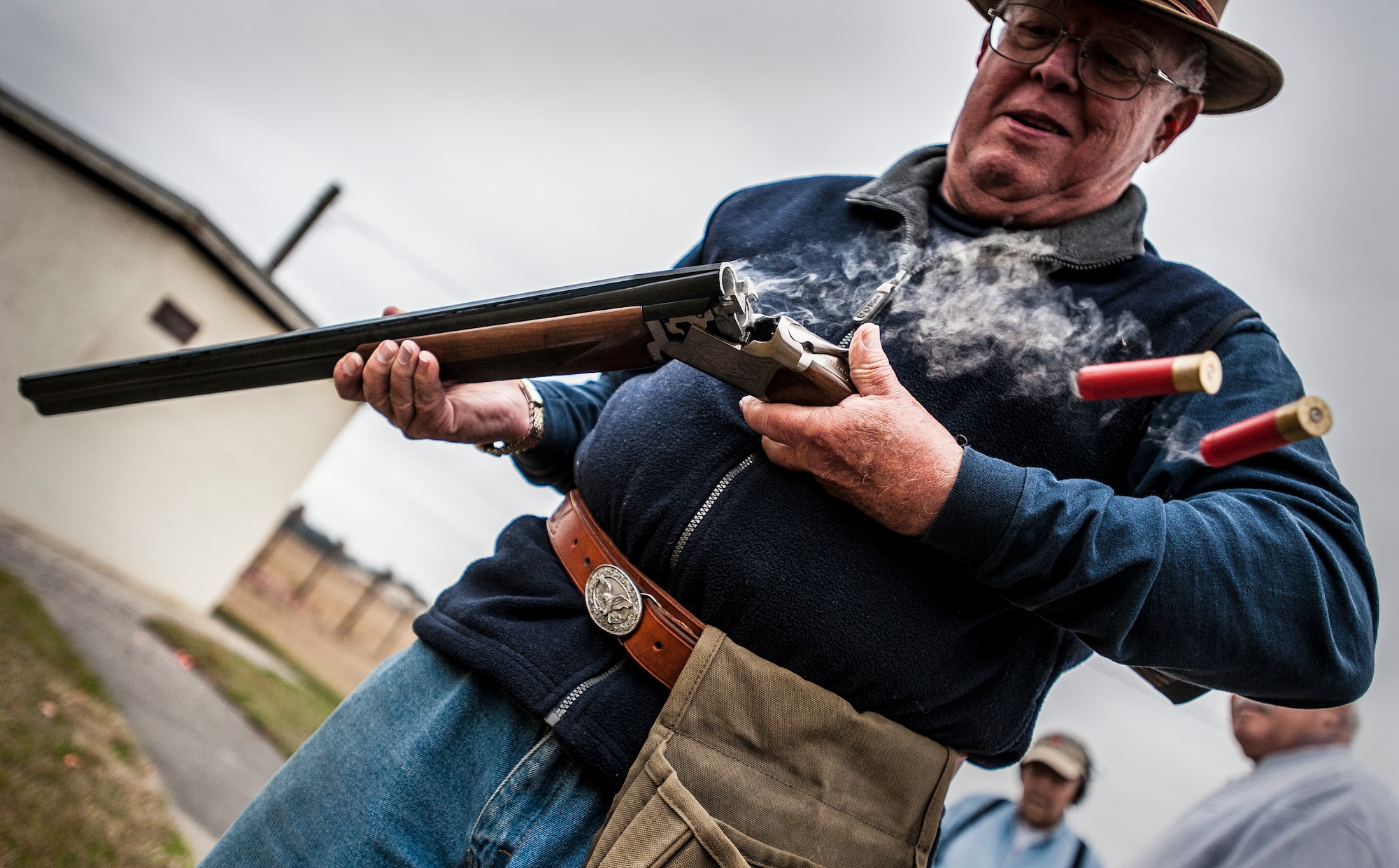 Retired Navy Captain Jean Van Slate, skeet shooting participant, releases two shell casings from his shotgun during a round of skeet Dec. 15, 2012, at Joint Base Charleston – air Base. The range is open to military and civilians but individuals without a military ID card are required to apply for a pass to get on base which requires a background check. (U.S. Air Force photo/ Senior Airman Dennis Sloan)