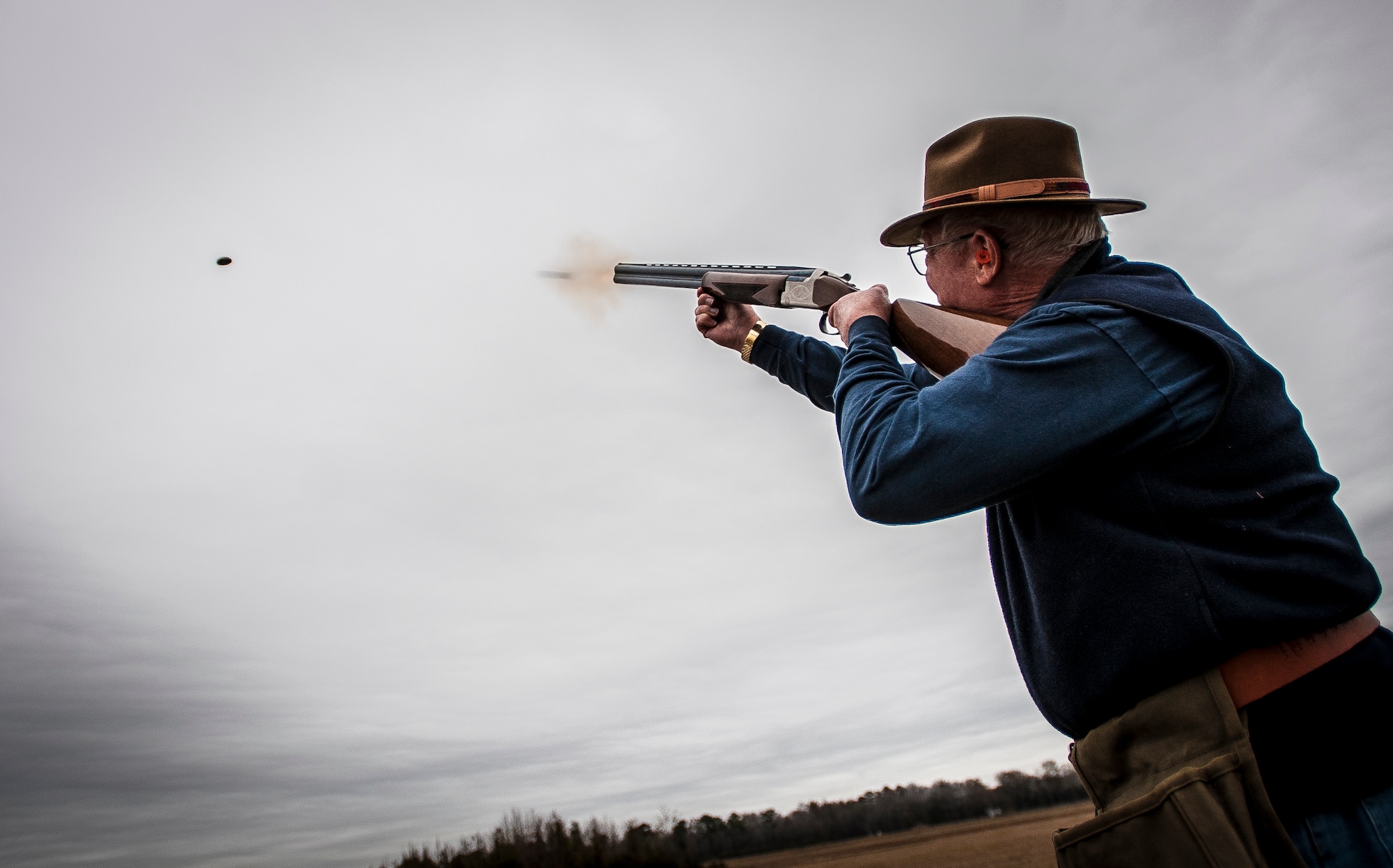 Retired Navy Captain Jean Van Slate, skeet shooting participant shoots at a clay bird during a round of skeet Dec. 15, 2012, at JB Charleston – Air Base. The range is open to military and civilians, but individuals without a military ID card are required to apply for a pass to get on base which requires a background check. (U.S. Air Force photo/ Senior Airman Dennis Sloan)