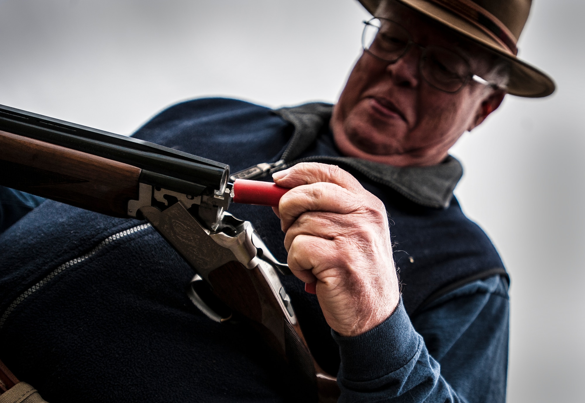 Retired Navy Captain Jean Van Slate, skeet shooting participant, loads a shell casing into his shotgun during a round of skeet Dec. 15, 2012, at JB Charleston – Air Base. The range is open to military and civilians, but individuals without a military ID card are required to apply for a pass to get on base which requires a background check. (U.S. Air Force photo/ Senior Airman Dennis Sloan)