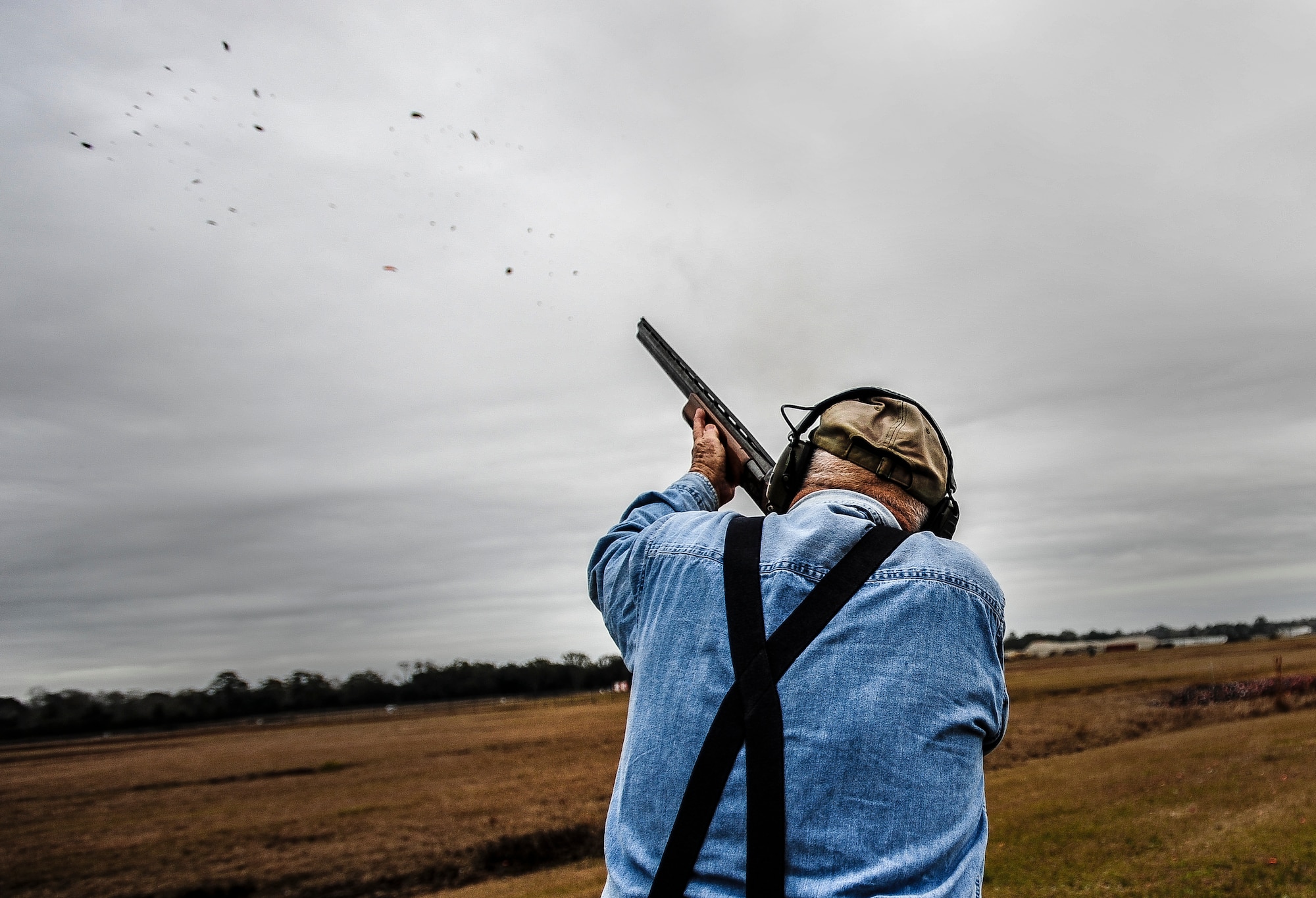 Lee Hunt, Joint Base Charleston Skeet and Trap Range volunteer, shatters a clay bird during a round of skeet Dec. 15, 2012, at JB Charleston – Air Base.  Hunt started the range, after his service in the Navy, and at 86-years old, he still helps run the range as a volunteer. (U.S. Air Force photo/ Senior Airman Dennis Sloan)