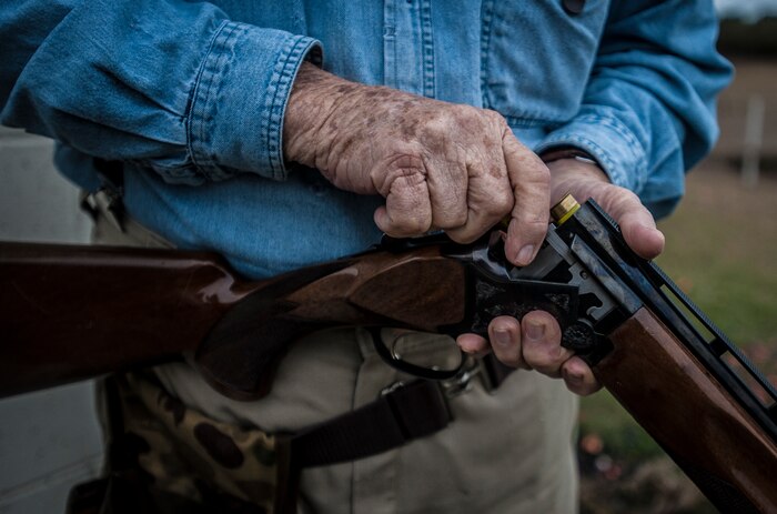 Lee Hunt, Joint Base Charleston Skeet and Trap Range volunteer, loads his shotgun before shooting a round of skeet with attendees Dec. 15, 2012, at Joint Base Charleston – Air Base. Hunt started the range after his service in the Navy, and at 86-years old, he still helps run the range as a volunteer. (U.S. Air Force photo/ Senior Airman Dennis Sloan)