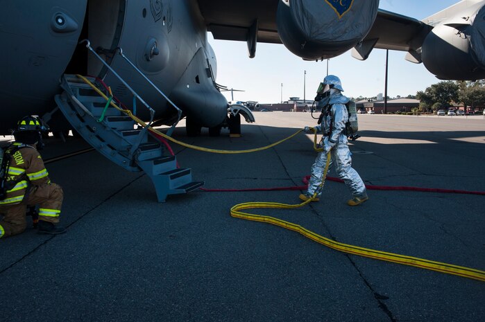 Firefighters from the 628th Civil Engineer Squadron take part in a C-17 Globemaster III emergency response drill  Dec. 19, 2012, at Joint Base Charleston - Air Base, S.C. During the Globemaster III drill, firefighters practiced for a real life situation such as a plane crash with a fire, smoke and casualties.  The drill takes place eight times a year. (U.S. Air Force photo/ Airman 1st Class Ashlee Galloway)
