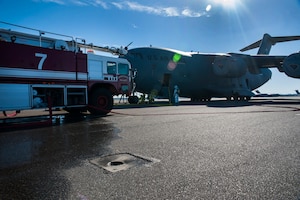 Firefighters from the 628th Civil Engineer Squadron take part in a C-17 Globemaster III emergency response drill Dec. 19, 2012 at Joint Base Charleston - Air Base, S.C. During the C-17 Globemaster III drill, firefighters practiced for a real life situation, such as a plane crash with a fire, smoke and casualties. The drill takes place eight times a year. (U.S. Air Force photo/ Airman 1st Class Ashlee Galloway) 