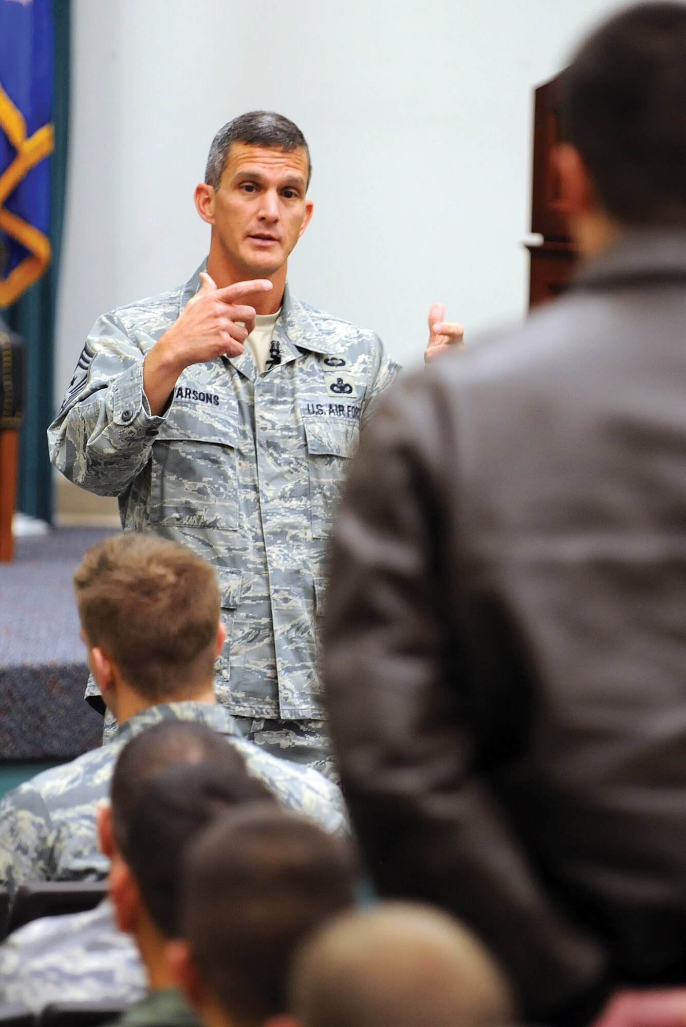 Chief Master Sgt. Richard Parsons, command chief of Air Combat Command at Langley AFB, Va., answers a 552nd Air Control Wing Airman’s question during his Dec. 10 All Call at Tinker AFB.  The command chief visited the wing Dec. 9-11, greeting and thanking Airmen as he went through the squadrons of the large wing here. (Air Force photo by Margo Wright)