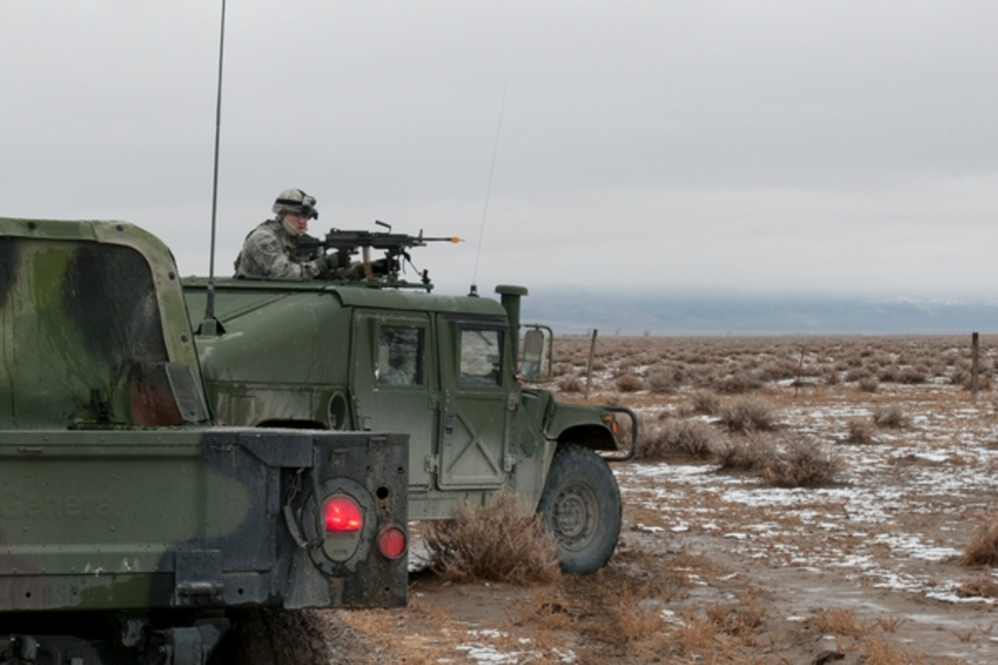 Airmen quickly break convoy formation and post security when one of their vehicles is notionally hit with a roadside bomb during the Air Wing Fallon exercise earlier this month. Photo by Staff Sgt. Mike Getten, Joint Force Headquarters Public Affairs