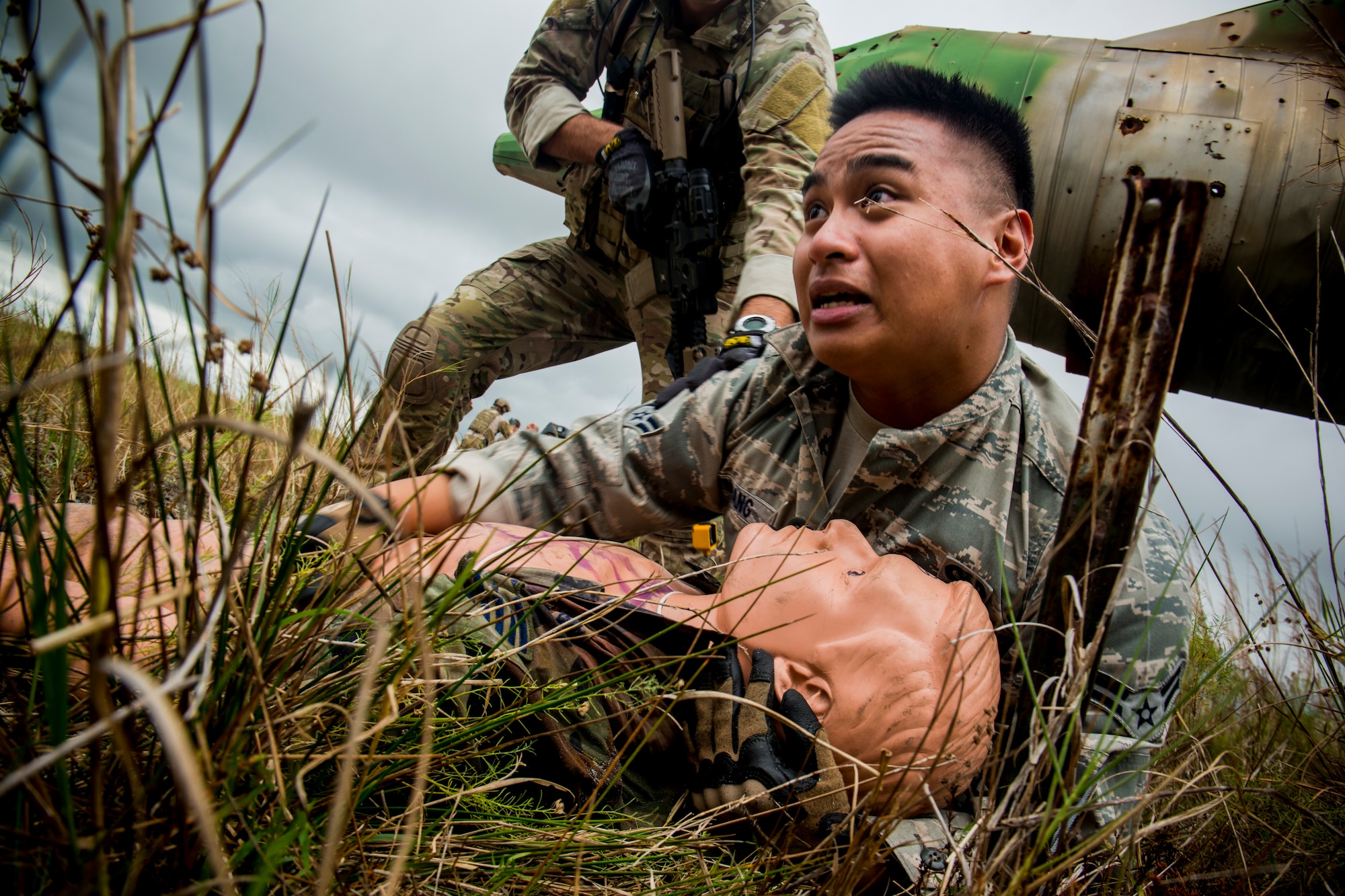U.S. Air Force Airman 1st Class Roman Timbang, 823d Base Defense Squadron fire team member, lies in distress during a training mission at Avon Park Air Force Range, Fla., Dec. 13, 2012. Timbang played the role of an uncooperative victim trying to protect his dead wingman after an attack. (U.S. Air Force photo by Staff Sgt. Jamal D. Sutter/Released) 