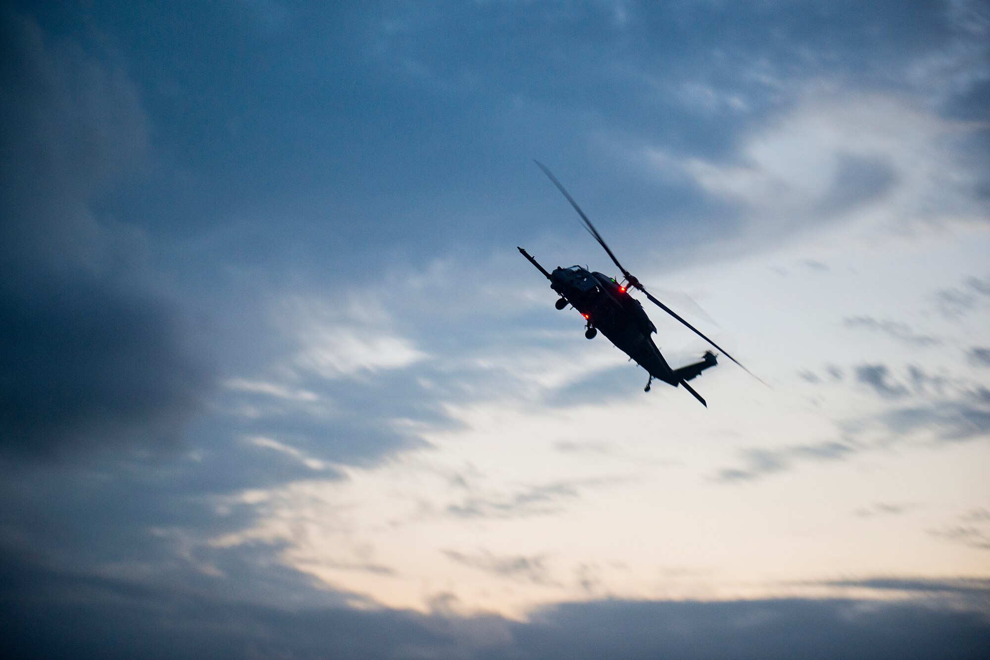 An HH-60G Pave Hawk assigned to the 41st Rescue Squadron maneuvers over the skies of Avon Park Air Force Range, Fla., Dec. 12, 2012. The helicopter was one of three from Moody Air Force Base, Ga., that participated in a three-day exercise with the 38th Rescue Squadron and 823d Base Defense Squadron. (U.S. Air Force photo by Staff Sgt. Jamal D. Sutter/Released)