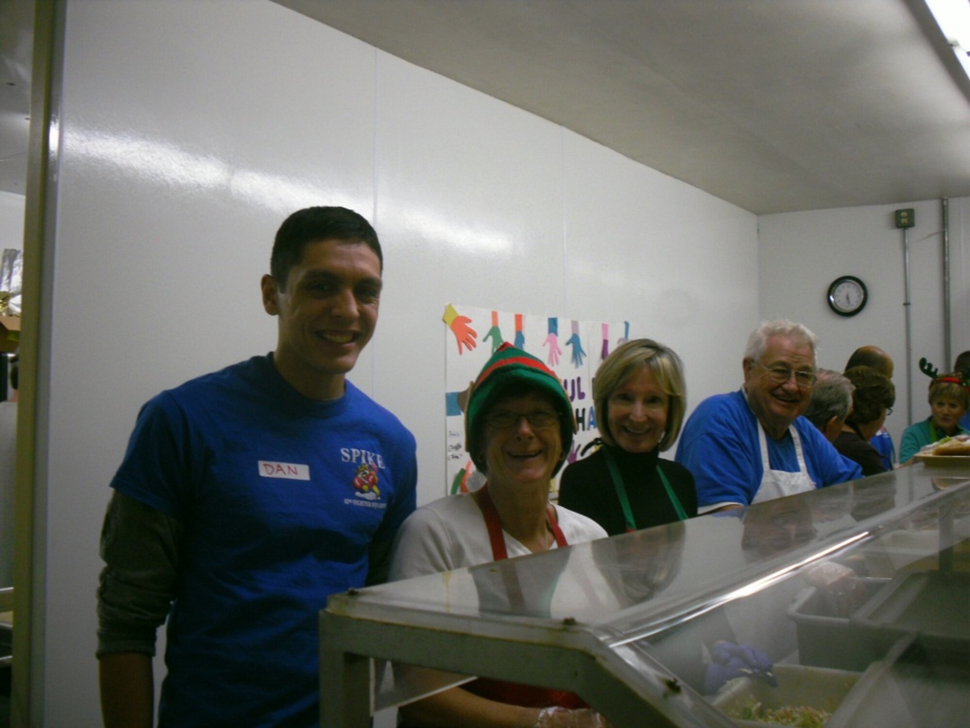 1st Lt. Dan Wabinga, 62nd FS B-Course student, left, and other volunteers
prepare to serve food in the Soupline Dec. 20 at the André House of
Hospitality in Phoenix, Ariz. The André House of Hospitality is a ministry
to the homeless and poor populations and serves a Soupline meal every
evening with the help of volunteers. (Courtesy photo)
