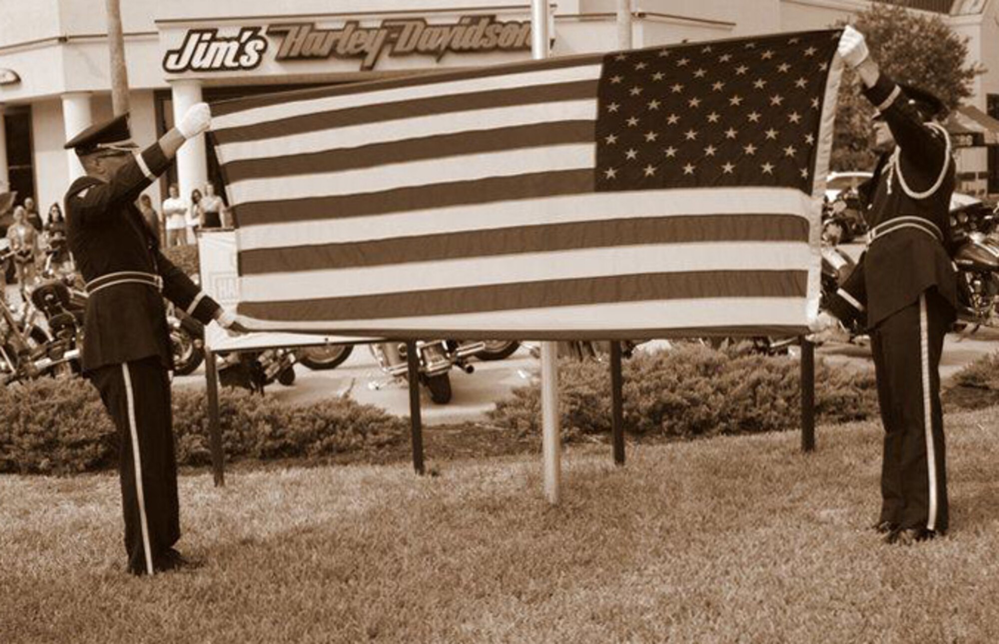 MacDill Air Force Base, Fla. – Technical Sgt. Scott Sendtko, left, and Staff Sgt. Robert MacEachern, right, display the American flag during a ceremony recently.  Both are members of the 927th Air Refueling Wing’s Honor Guard, which over the span of two days worked more than 50 hours and travelled more than 450 miles as they performed at ten separate events.  (Official U.S. Air Force photo/Courtesy of Tech. Sgt. Scott Sendtko)