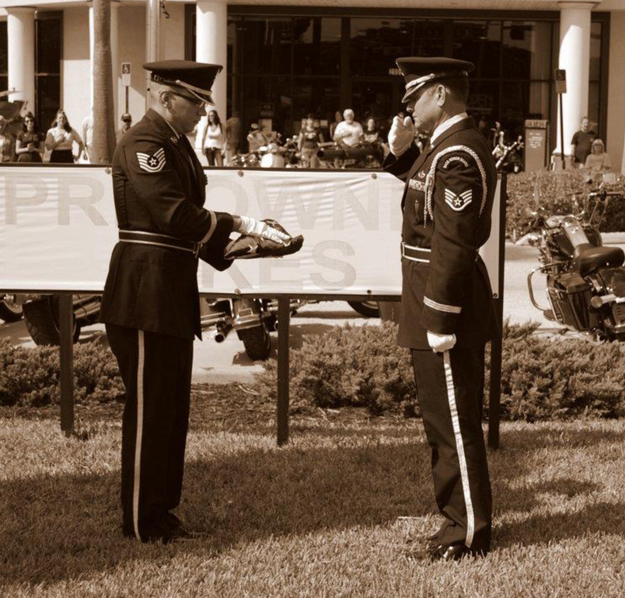 MacDill Air Force Base, Fla. – Technical Sgt. Scott Sendtko, left, and Staff Sgt. Robert MacEachern, right, prepare to hand off a flag during a ceremony recently.  Both are members of the 927th Air Refueling Wing’s Honor Guard, which over the span of two days worked more than 50 hours and travelled more than 450 miles as they performed at ten separate events.  (Official U.S. Air Force photo/Courtesy of Tech. Sgt. Scott Sendtko)
