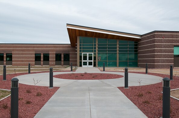 The ribbon cutting ceremony for new Nuclear Security Tactics Training Center was held Dec. 13, 2012, in Guernsey, Wyo. The new facility will increase the 620th Ground Combat Training Squadron's training capabilities by four times. (U.S. Air Force photo/R.J. Oriez) 

