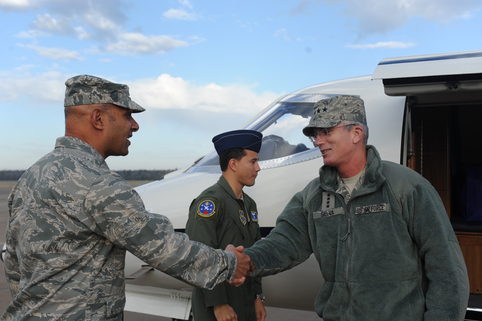 Gen. Paul J. Selva, Air Mobility Command commander, is greeted by Col. Brian Robinson, 19th Airlift Wing commander, Dec. 17, 2012, at Little Rock Air Force Base, Ark. This was Selva’s first visit to Little Rock AFB as the new AMC commander. (U.S. Air Force photo by Airman 1st Class Cliffton Dolezal)