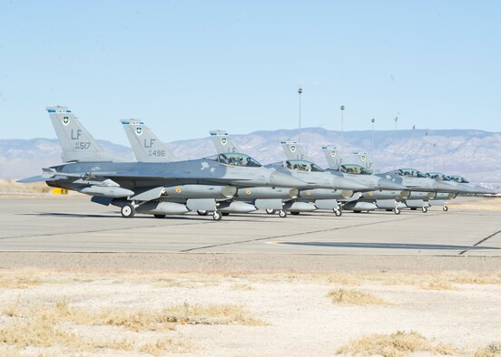 Six F-16 Fighting Falcons from the 309th Fighter Squadron, stage Dec. 7 at the end of the runway at Holloman Air Force Base, N.M. (U.S. Air Force photo/Senior Airman DeAndre Curtiss)