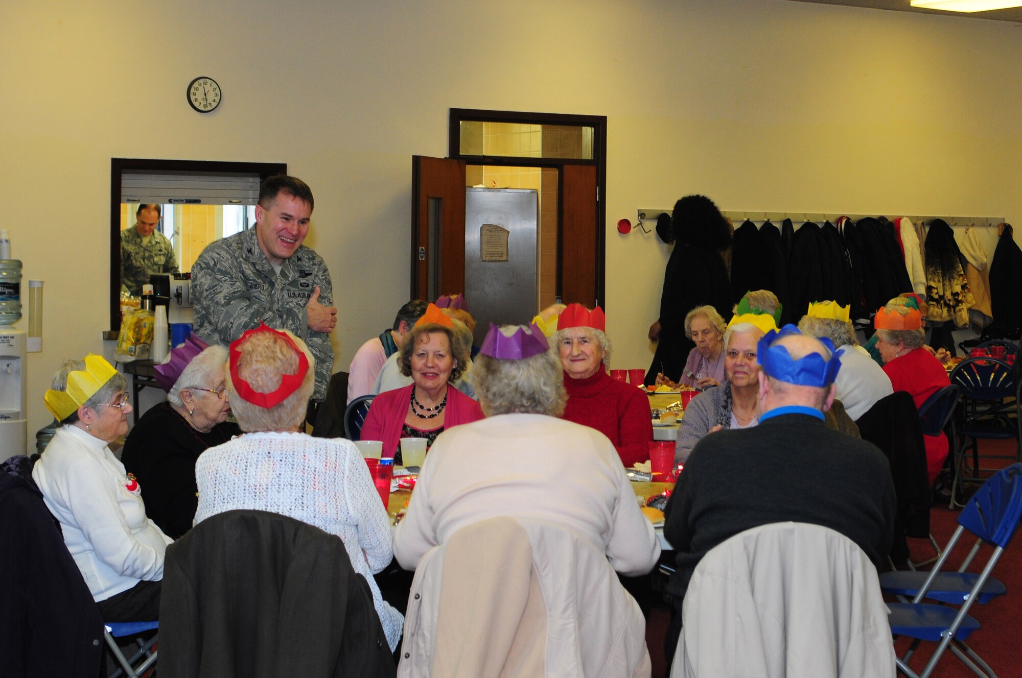 ROYAL AIR FORCE LAKENHEATH, England – Col. Mark K. Ciero (left), 48th Fighter Wing vice commander, visits with local community members from Mildenhall Village during a Christmas lunch hosted by the 48th Security Forces Squadron Dec. 19, 2012. More than 40 members of the local community attended the luncheon which included games, prizes and holiday gifts donated by Liberty Wing Airmen. (U.S. Air Force photo by Airman 1st Class Cory D. Payne)