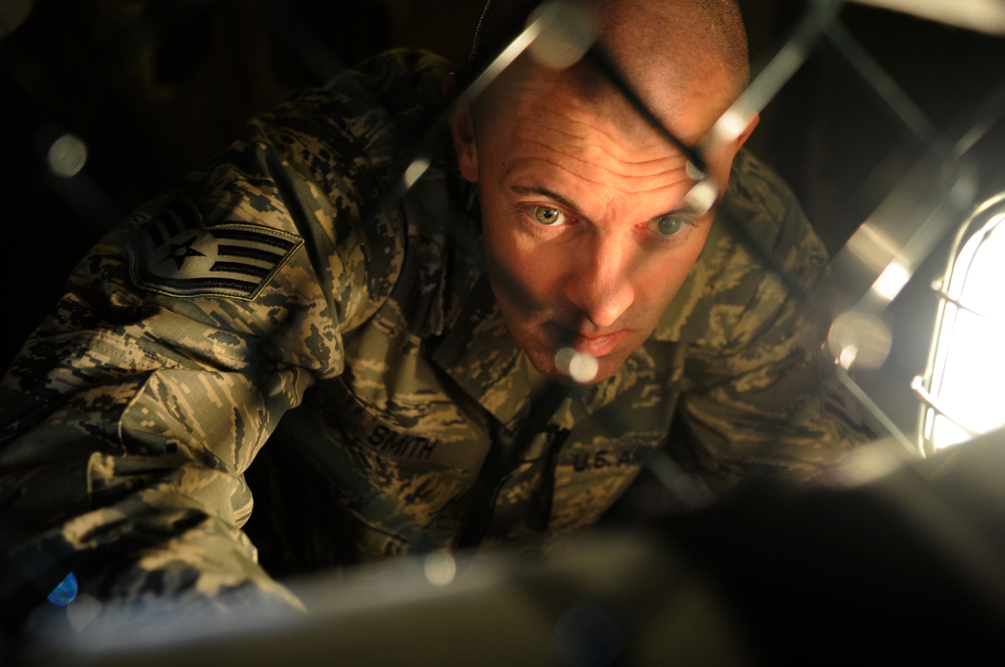 Staff Sgt. Joshua Smith, 8th Operations Support Squadron aircrew flight equipment assistant NCO in charge, thoroughly inspects an anti-exposure suit Dec. 11, 2012, at Kunsan Air Base, Republic of Korea. Depending on the suit’s model, AFE technicians perform water and air testing every 180 or 360 days to ensure it is flight ready. (U.S. Air Force photo by Senior Airman Brigitte N. Brantley/Released)