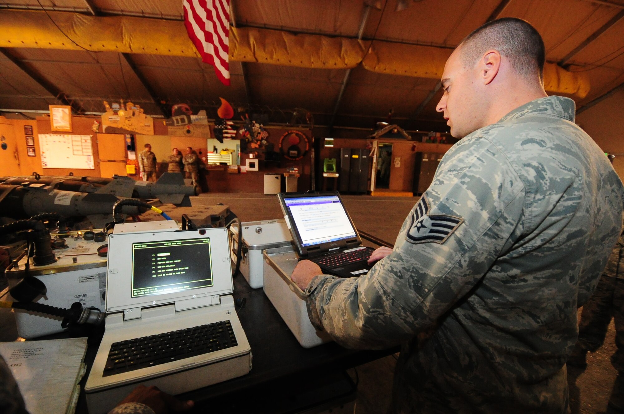 SOUTHWEST ASIA -- Staff Sgt. Ryan Thompson, 379th Expeditionary Maintenance Squadron Conventional Munitions shop, runs an equipment and softare diagnostic on a GBU-54 Laser Joint Direct Attack Munition recently downloaded from a B-1B Lancer assigned to the 379th Air Expeditionary Wing Dec. 19. If the munitions aren't utilized during a mission, they are returned, inspected, software packages upgraded and stored for later use. (U.S. Air Force photo/ Master Sgt Brendan Kavanaugh)