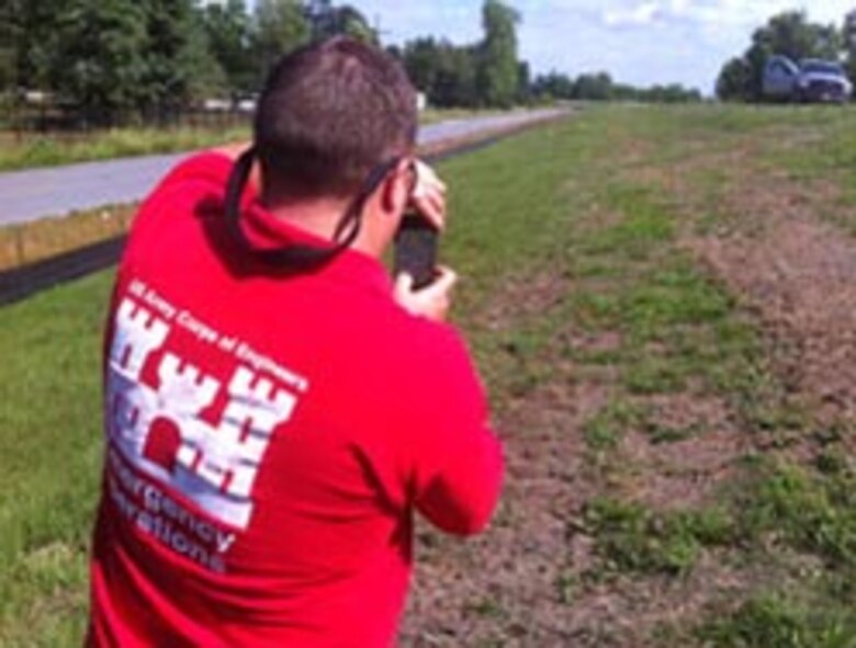 A USACE Emergency Operations worker uses the Mobile Information Collection Application (MICA) to capture levee data.