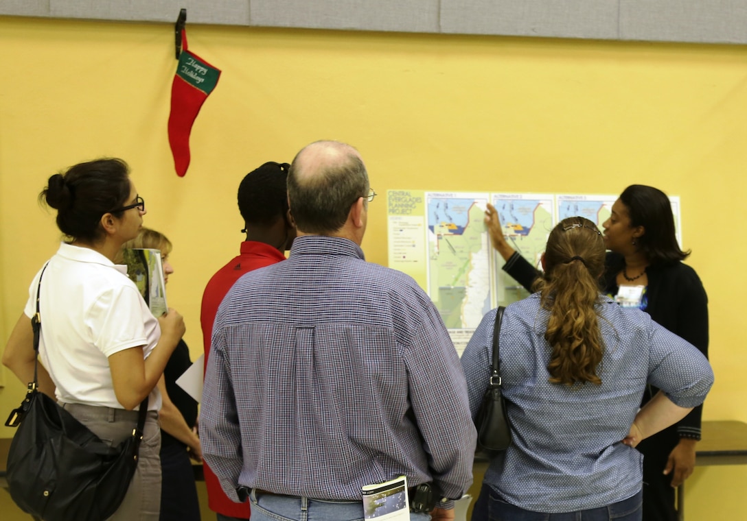 Murika Davis (right), Jacksonville District engineer, explains the proposed altenatives for the  Central Everglades Planning Project (CEPP) at the Dec. 12 public meeting in Clewiston, Fla. An open house was held at each of the five public meetings conducted throughout south Florida Dec. 10-13 and Dec. 18.