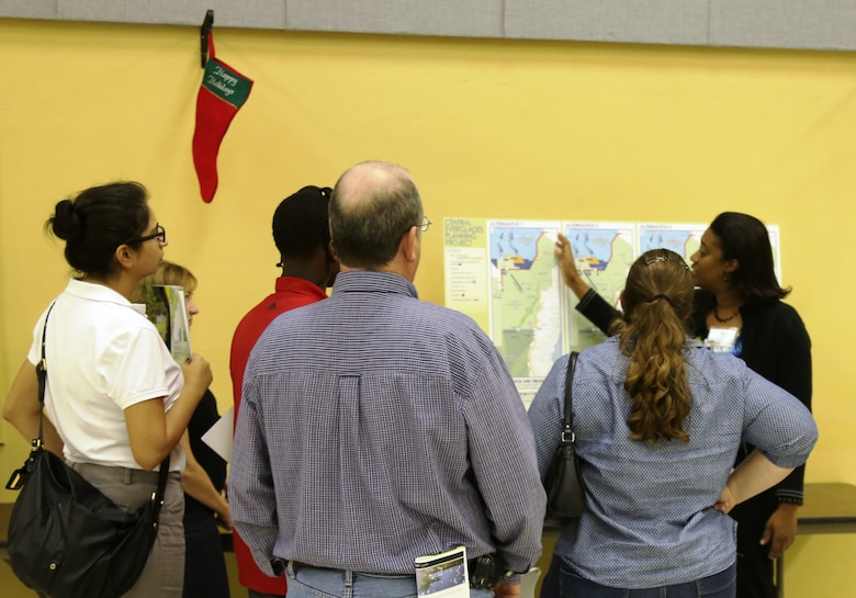 Murika Davis (right), Jacksonville District engineer, explains the proposed altenatives for the  Central Everglades Planning Project (CEPP) at the Dec. 12 public meeting in Clewiston, Fla. An open house was held at each of the five public meetings conducted throughout south Florida Dec. 10-13 and Dec. 18.