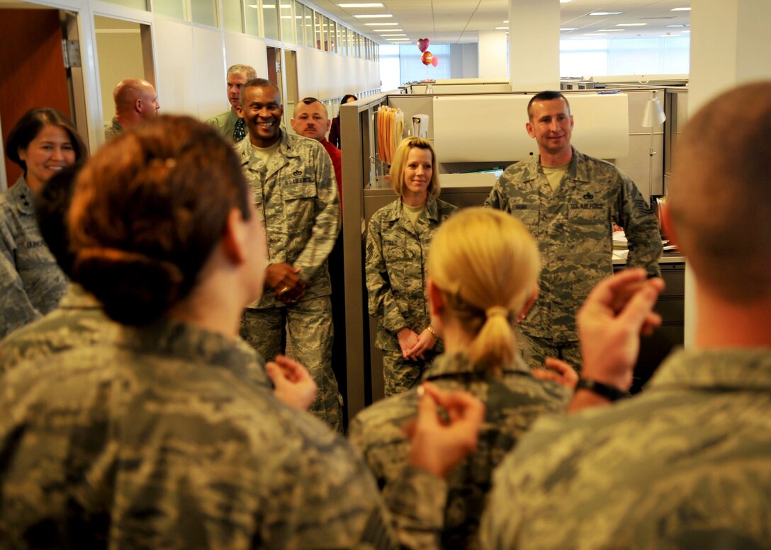 The United States Air Force Band Singing Sergeants snap their fingers while singing holiday carols for Air Force District of Washington Airmen at Joint Base Andrews, Md. Dec. 18, 2012. (U.S. Air Force photo by 1st Lt. Ashleigh Peck)