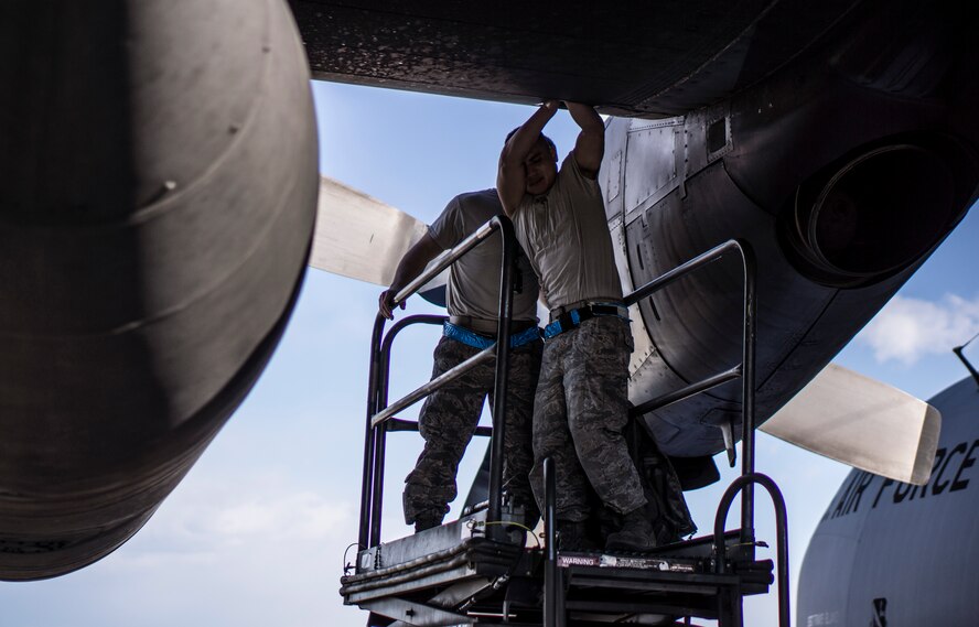YOKOTA AIR BASE, Japan -- Maintenance crews work on a C-130 Hercules at Yokota Air Base, Japan, in preparation for Operation Christmas Drop Dec. 12, 2012. (U.S. Air Force photo by Tech. Sgt. Samuel Morse)