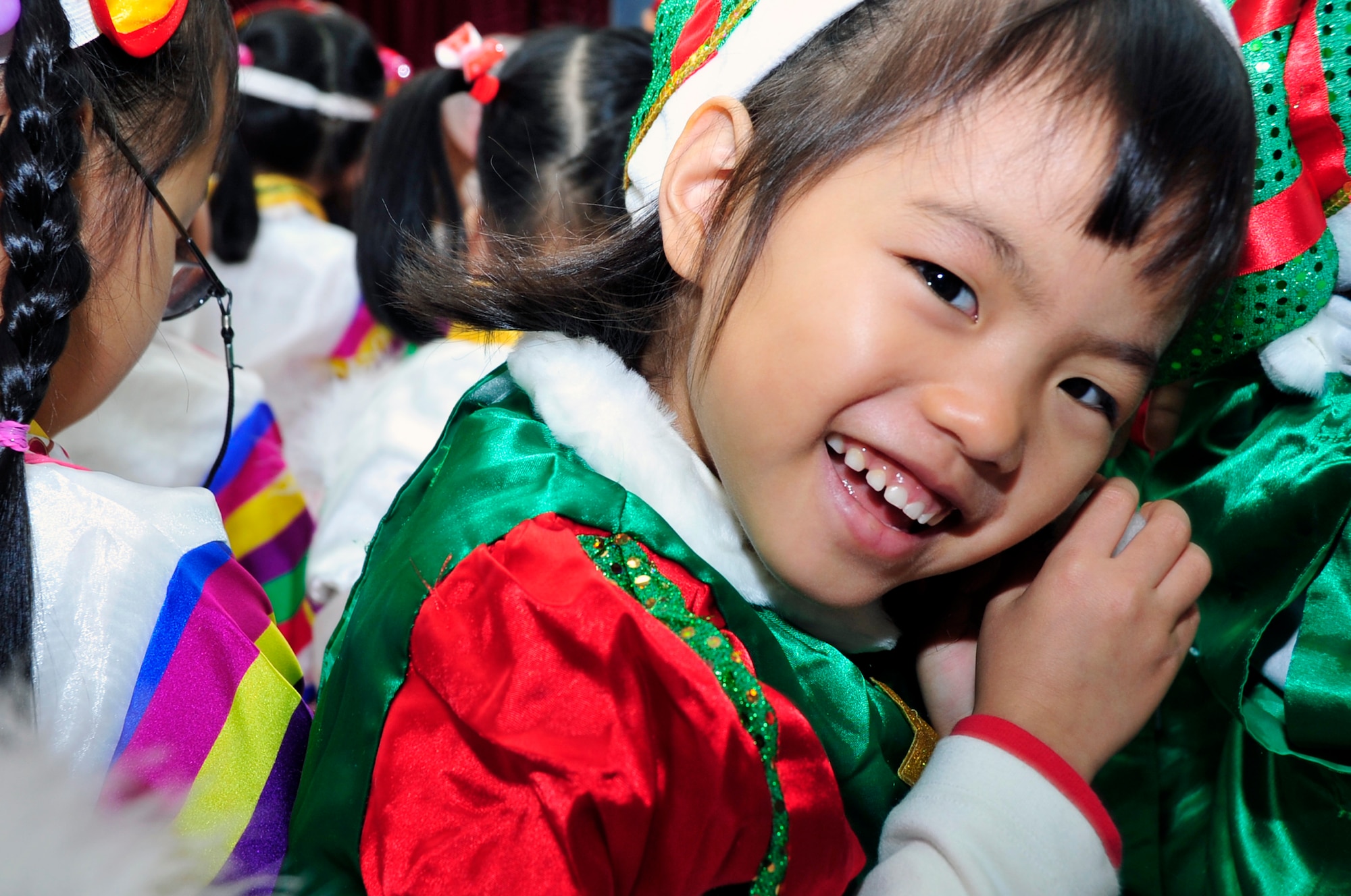 A Korean orphan smiles for a photo at a Korean orphanage Dec. 22, 2012. Team Osan gave back during the holidays by ensuring children in local orphanages received a little bit of cheer and a gift. (U.S. Air Force photo/Airman 1st Class Alexis Siekert)