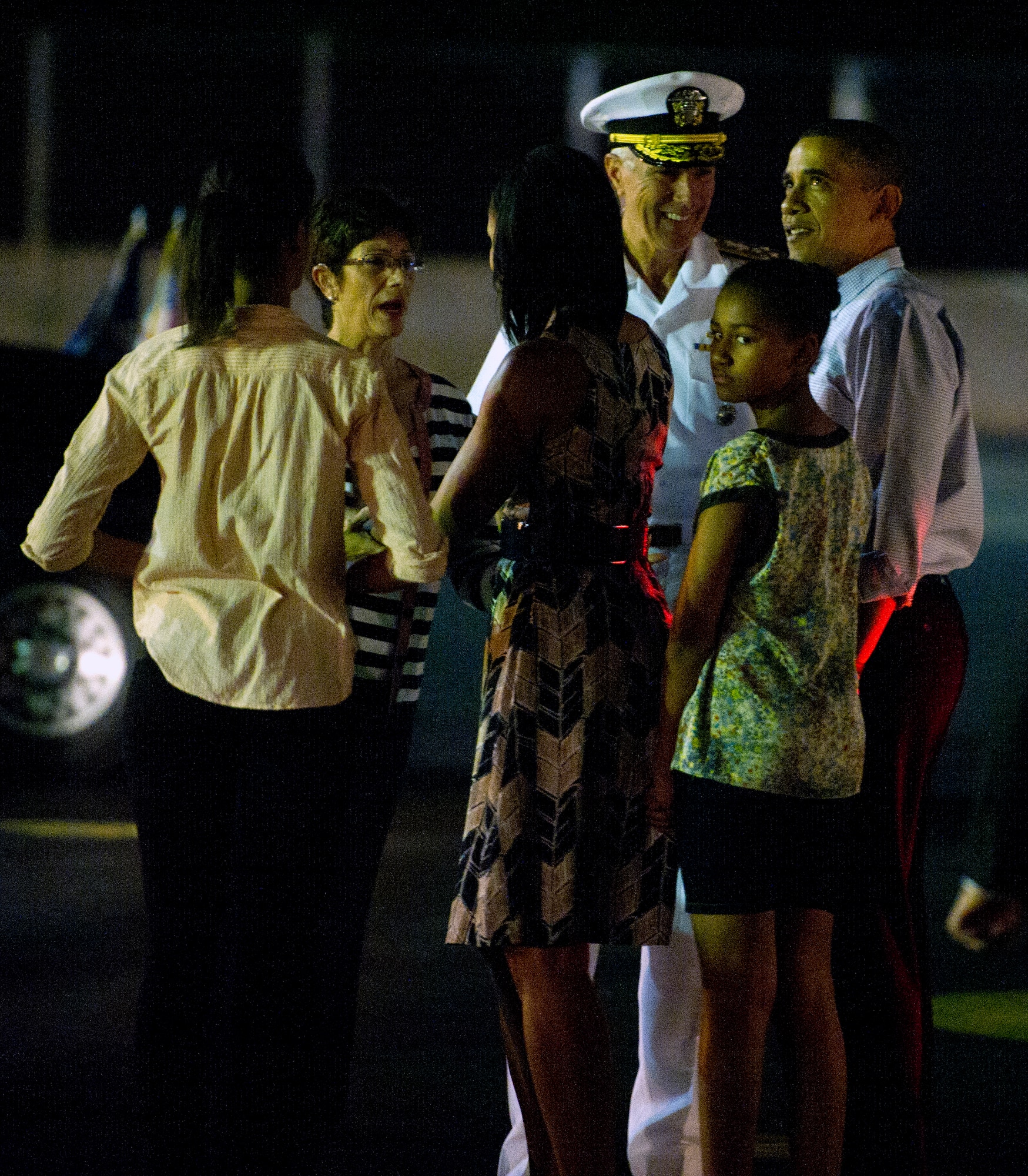 The first family is greeted by Adm. Samuel J. Locklear, U.S. Pacific Command commander, and his wife upon their arrival at Joint Base Pearl Harbor-Hickam, Hawaii, Dec. 22. The President and his family are expected to vacation on the island of Oahu through the holiday. (U.S. Air Force photo/Staff Sgt. Nathan Allen)