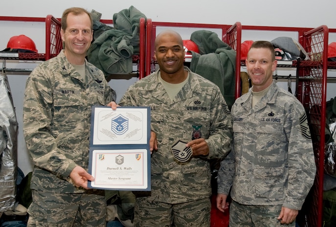 Col. Corey Martin, 376th Air Expeditionary Wing commander, and Chief Master Sgt. Bryan Creager, 376th Air Expeditionary Wing command chief notified Tech Sgt. Darnell Walls, 376th Expeditionary Civil Engineer Squadron Assistant chief of operations, of his promotion to the rank of master sergeant at Transit Center at Manas, Kyrgyzstan, Dec. 21, 2012. Wells received his promotion through the Stripes for Exceptional Performers program. Wells is currently deployed from Charleston Air Force Base, and is a native of Chicago, Ill. (U.S. Air Force / Staff Sgt. Stephanie Rubi) 